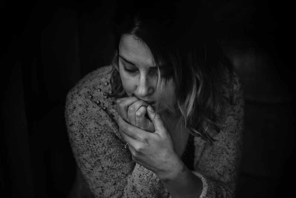 greyscale photography of woman wearing long sleeved top