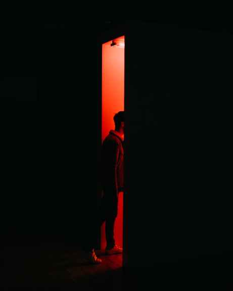 person standing on opened doorway
