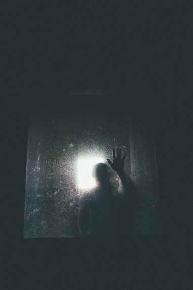 person behind glass door