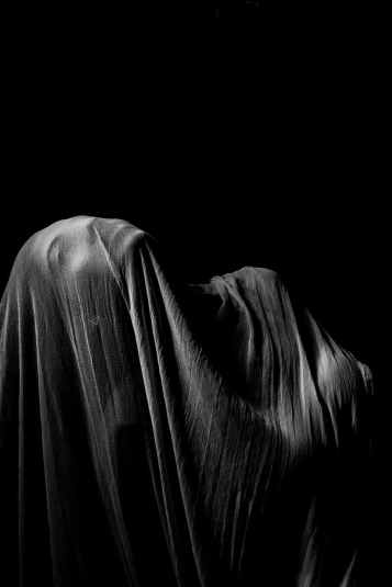 person s body covered with cloth