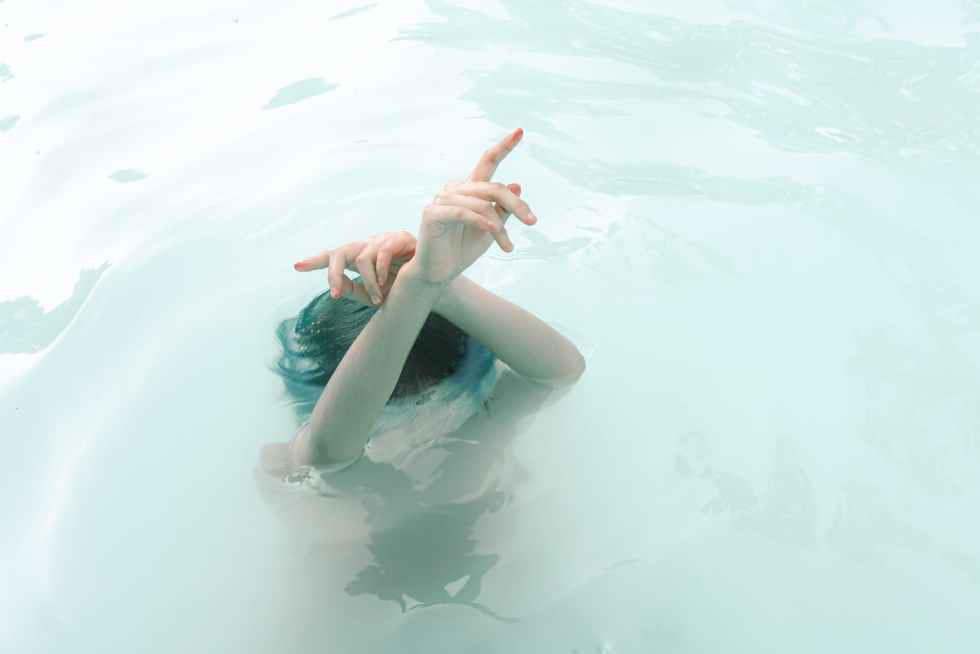 photo of woman submerged in water