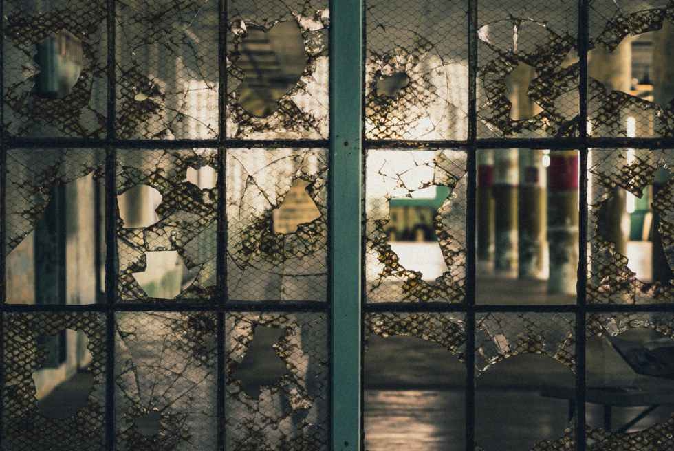 broken glass window with gray metal frame