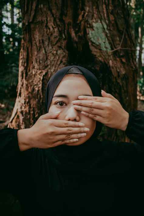 woman covering her face